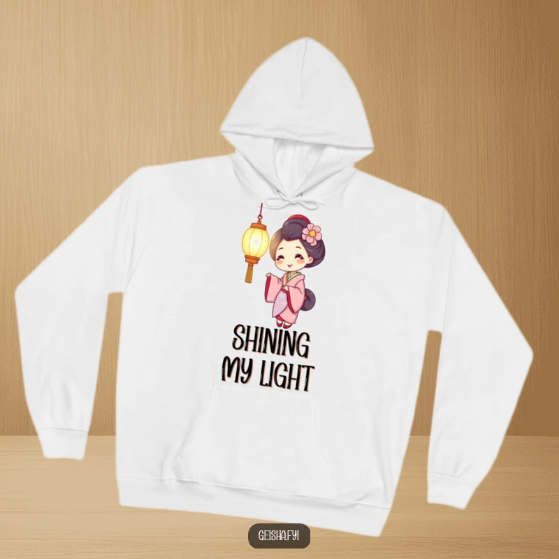 Funny geisha hoodie showing a smiling character holding a brightly glowing lantern, offering warmth, comfort, and cheerful illumination.